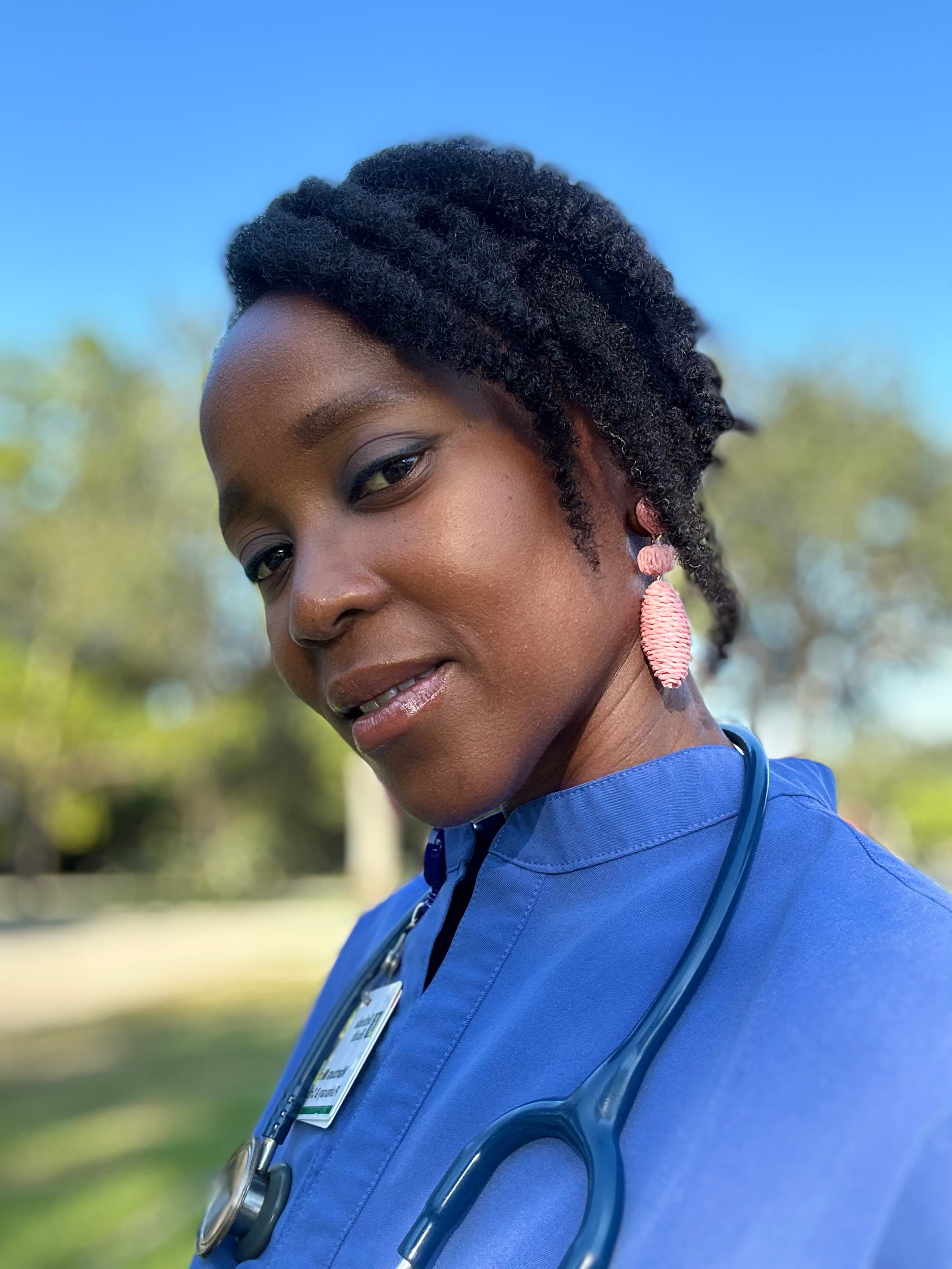 Dr. Wambura N. Mkono, a Board Certified Pulmonary and Critical Care Physician, in a professional headshot with a calm, confident expression