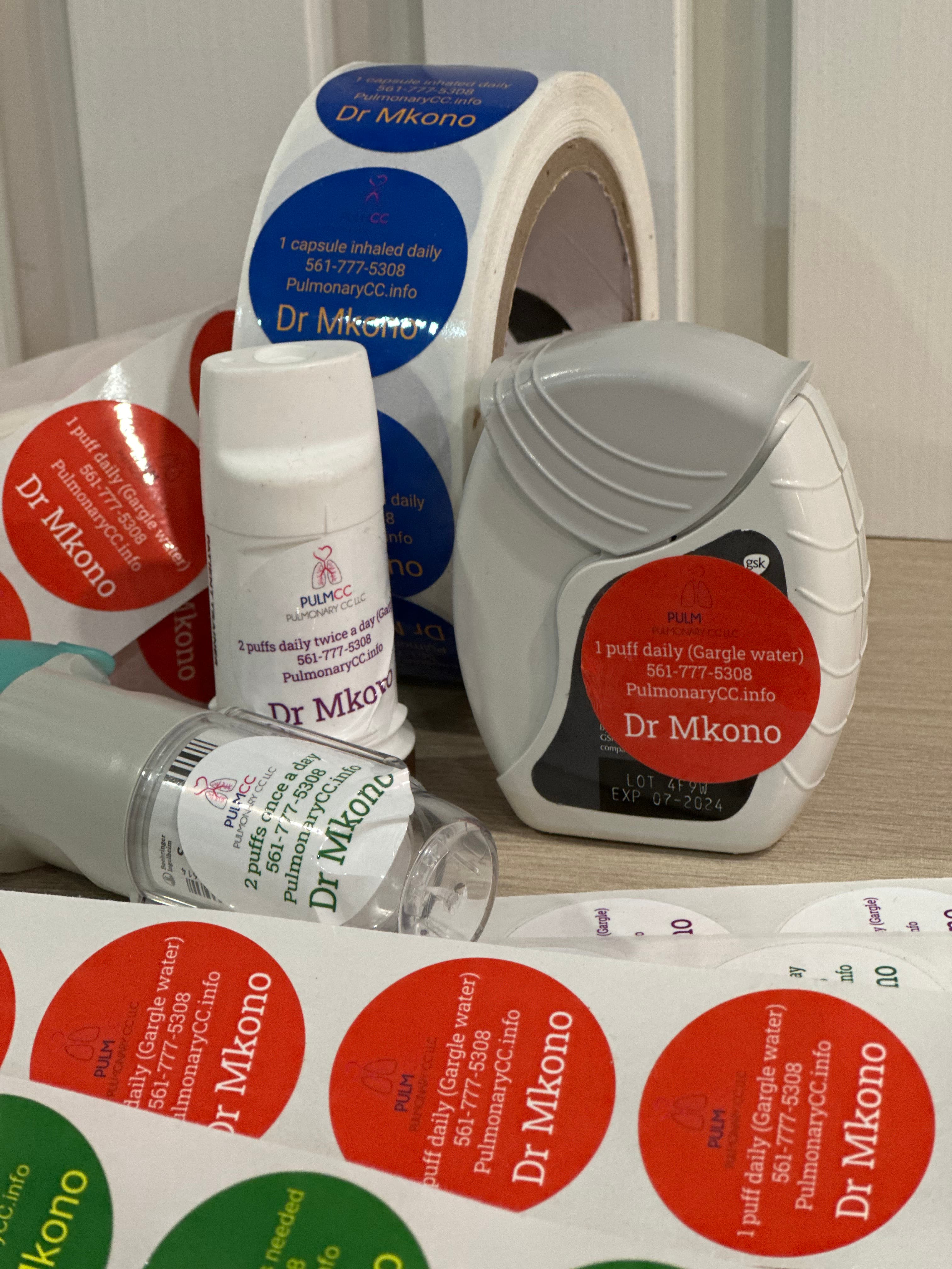 Medical inhalers and rolls of prescription labels with dosage instructions from Dr Mkono.